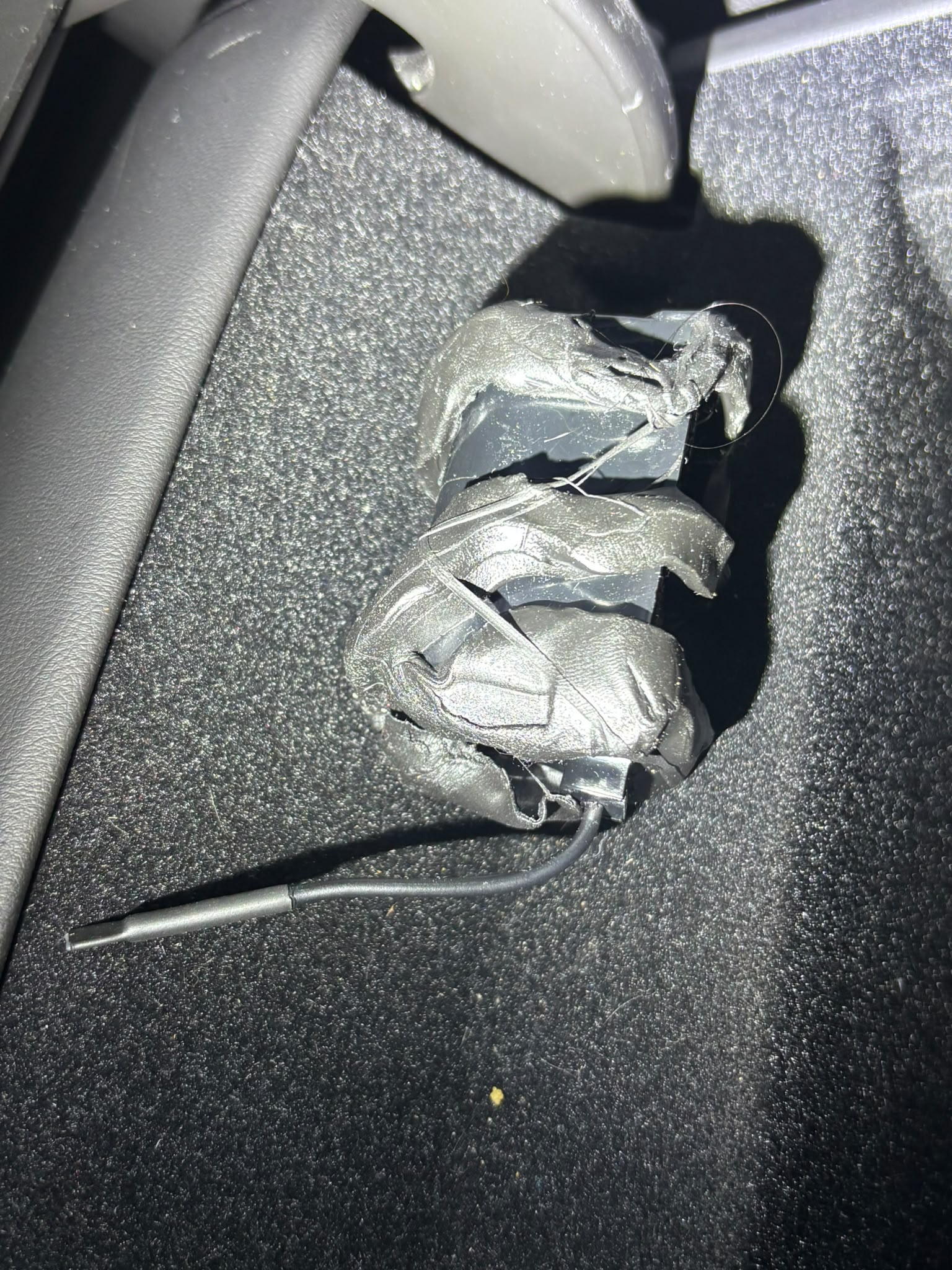 Recovery #2 — device in-place, wrapped in electrical tape, antenna wire exposed
